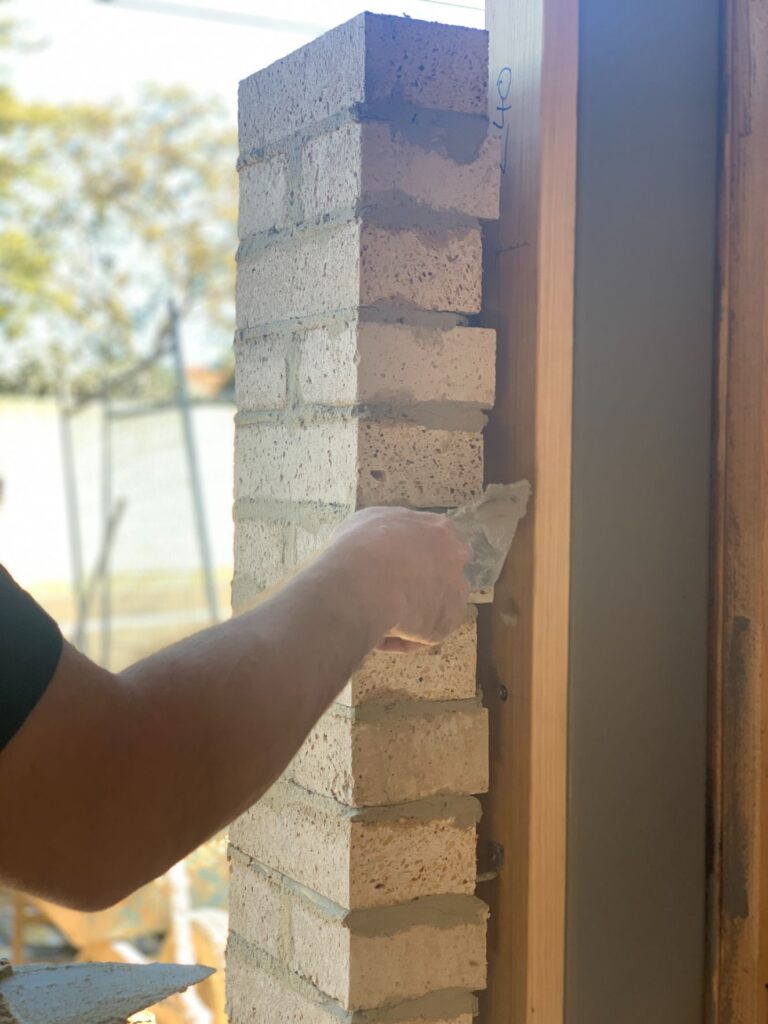 Bricklayers working in Lenah Valley Hobart on a new brick fence